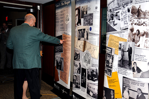 NASW Event, Man Pointing At Display Photo